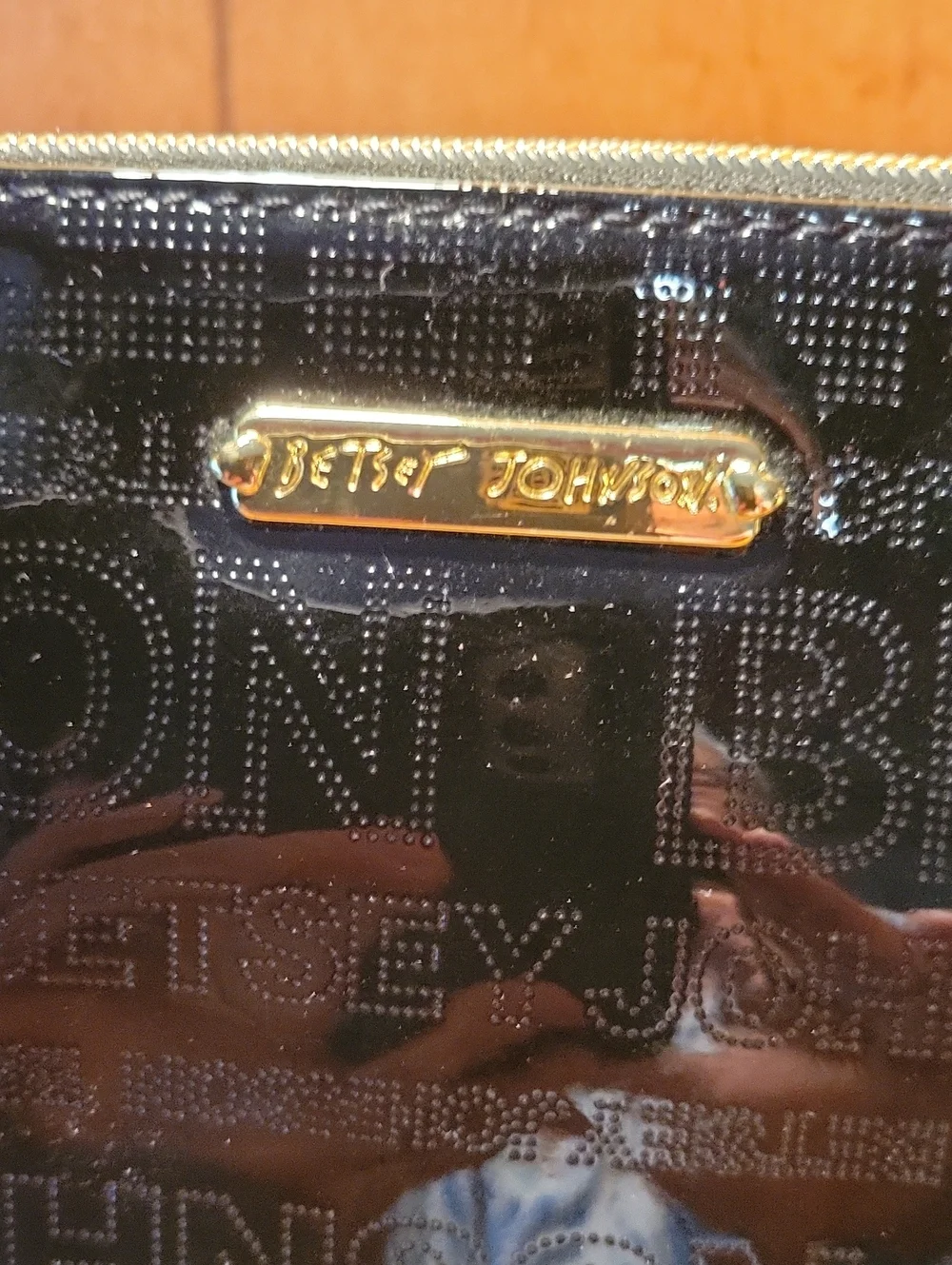 Betsey Johnson Black Patent Wristlet with Gold Accents and Cell Phone Charger